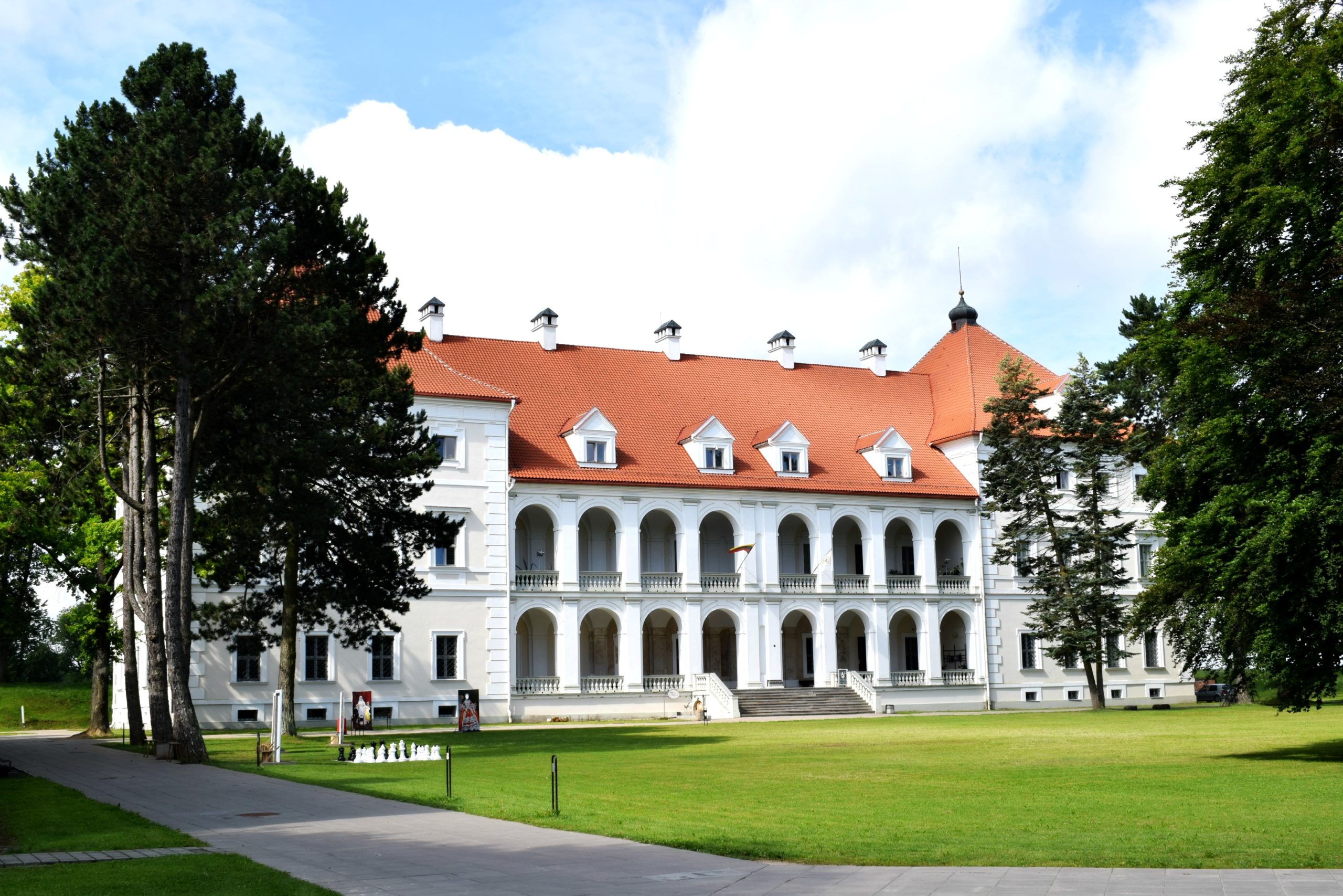 The castle of Birza, white classical building with arches.